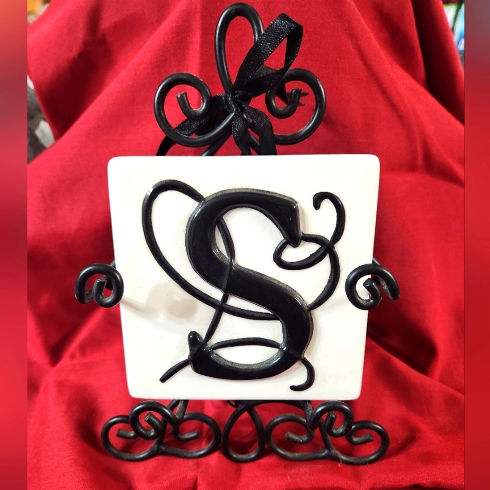 Decorative Tile with Black Letter S and Iron Stand
